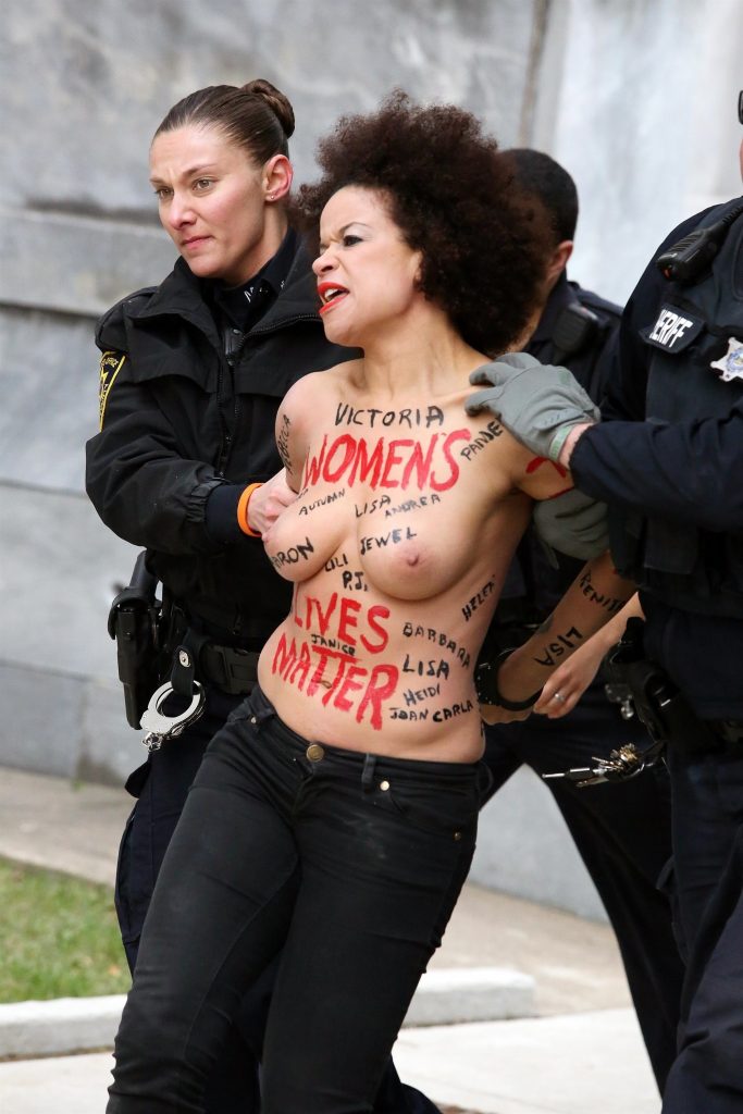 Police taking away a protestor – topless Nicole Rochelle pictures gallery, pic 6