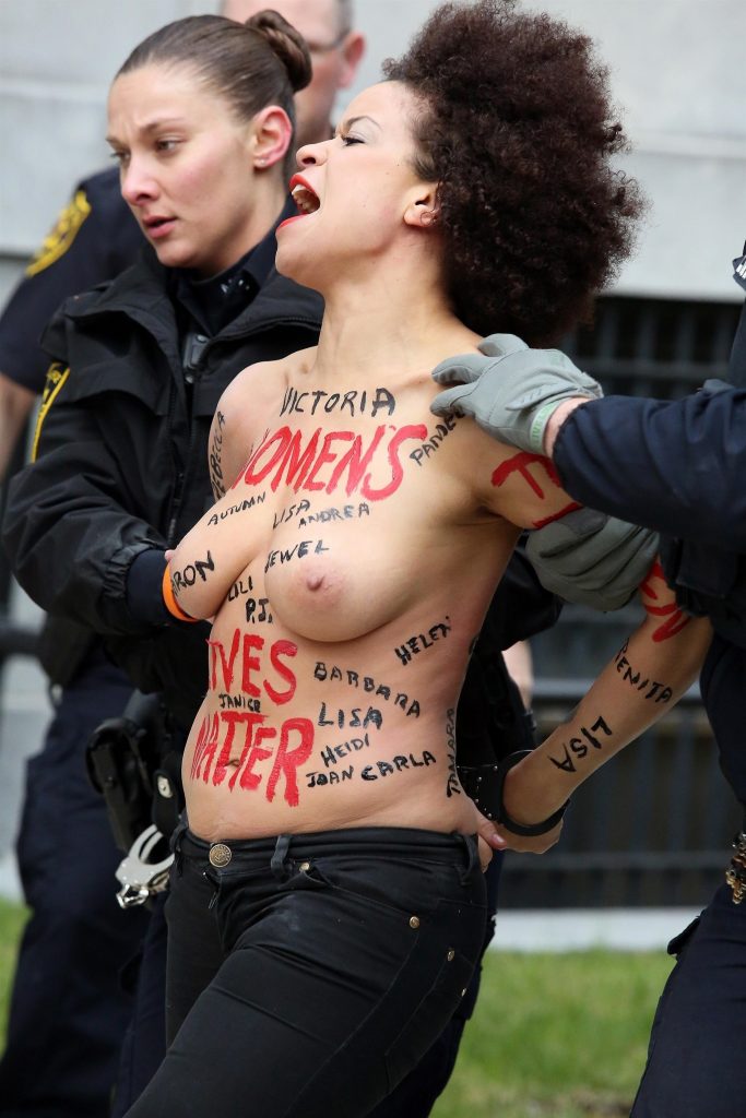 Police taking away a protestor – topless Nicole Rochelle pictures gallery, pic 10