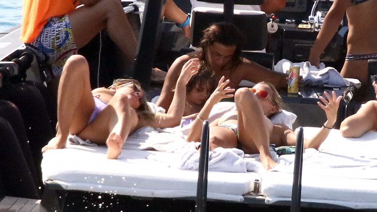 Topless Tania Cagnotto soaking up the sun with her good-looking girlfriends