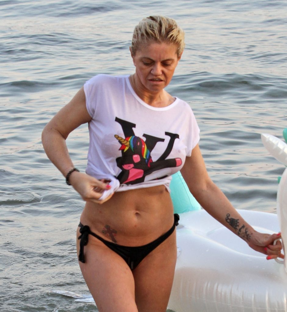 Tanned MILF blonde Danniella Westbrook showing her tits in a see-through shirt gallery, pic 12