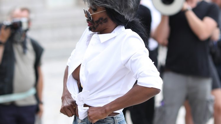 Sinitta dresses up as a marginally sexier version of Simon Cowell from X-Factor (nip slip)