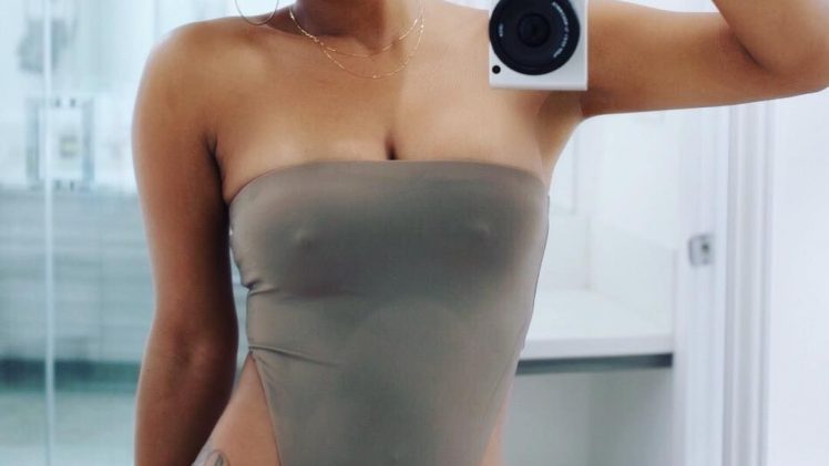 Christina Milian shows her pokies in a figure-hugging swimsuit with a classy necklace