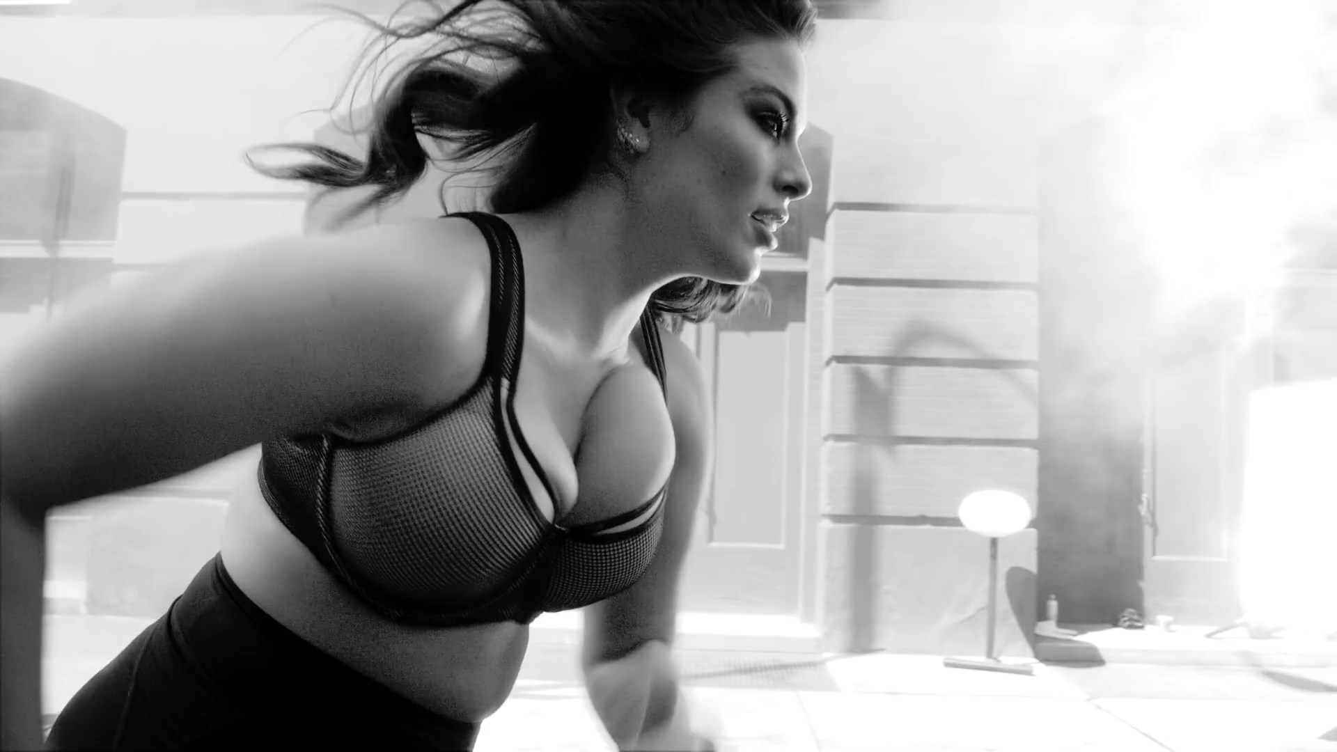 Ashley Graham showing her big breasts and ass in front of a camera.