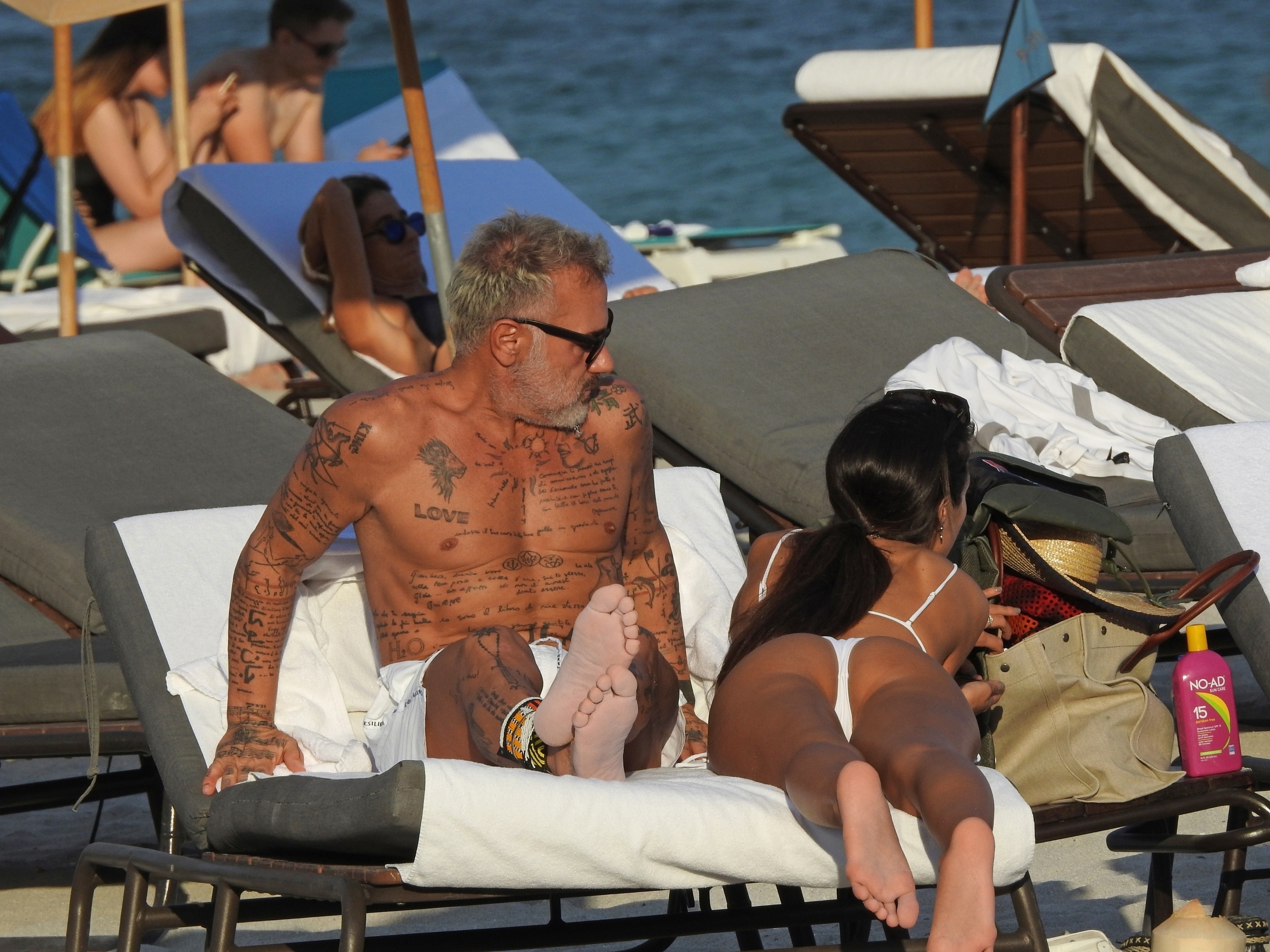 Sharon Fonseca hangs out with some beefy, inked-up grandpa (possibly a majo...