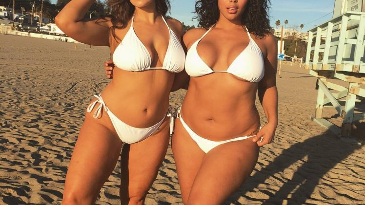 Ashley Graham and her thick girlfriend posing in their bikinis