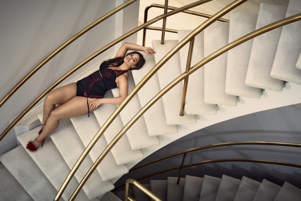 Thick bombshell Ashley Graham posing on the spiral staircase gallery, pic 12