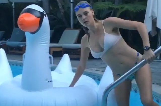 Adorkable blonde Kelly Rohrbach fooling around in the swimming pool