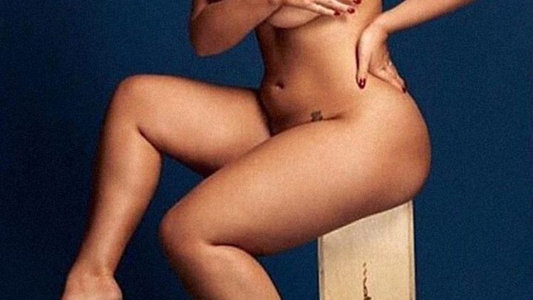 Ashley Graham poses naked but covers her big fat titties (3 Photos)