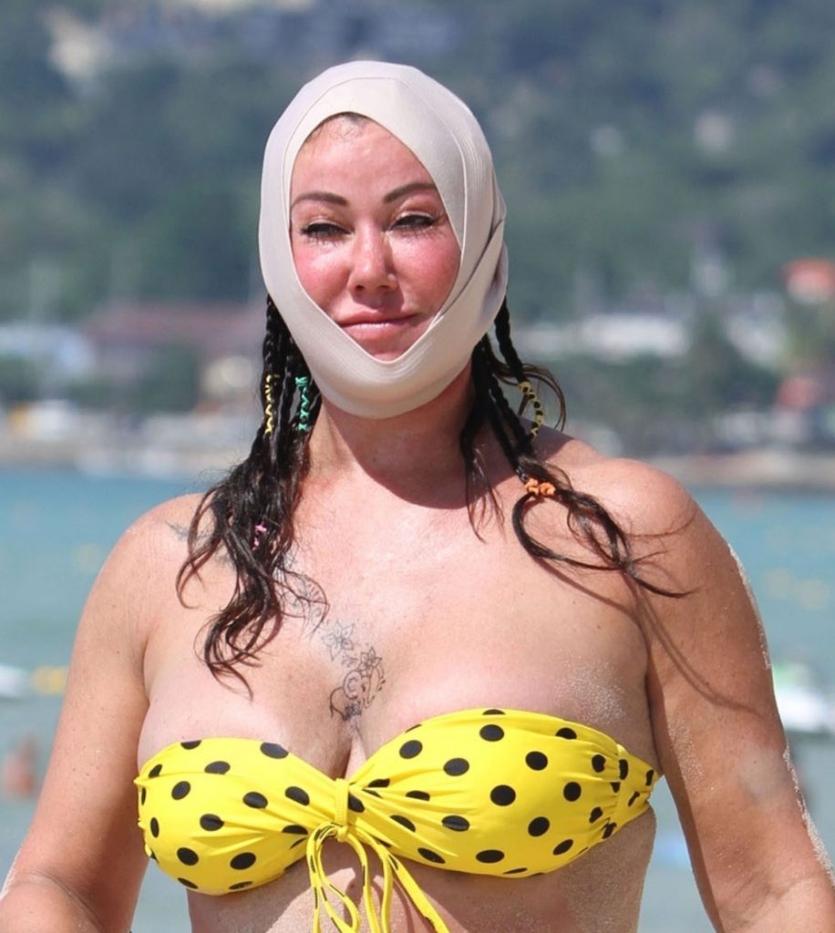 Ugly, fat, and old bitch named Lisa Appleton rolls around in the sand gallery, pic 2