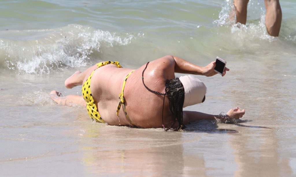 Ugly, fat, and old bitch named Lisa Appleton rolls around in the sand gallery, pic 124