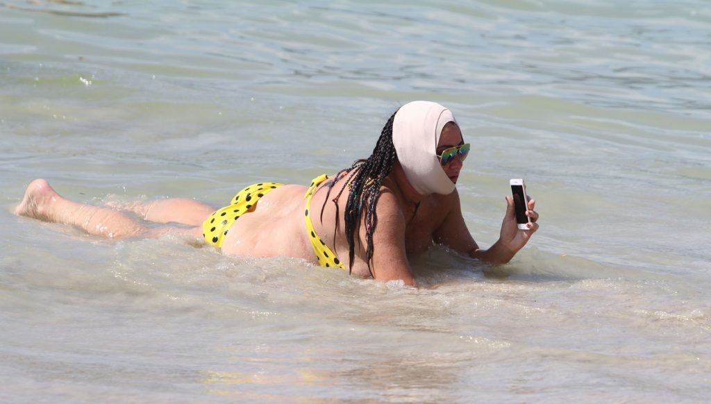 Ugly, fat, and old bitch named Lisa Appleton rolls around in the sand gallery, pic 140