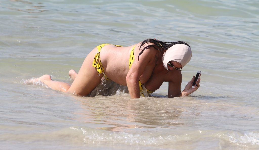Ugly, fat, and old bitch named Lisa Appleton rolls around in the sand gallery, pic 150