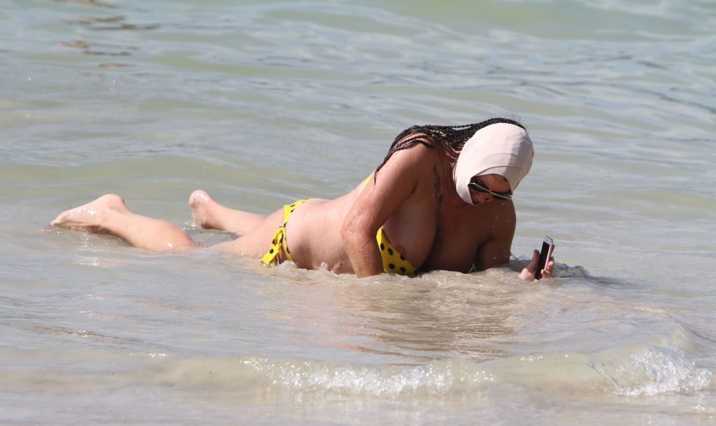 Ugly, fat, and old bitch named Lisa Appleton rolls around in the sand gallery, pic 152