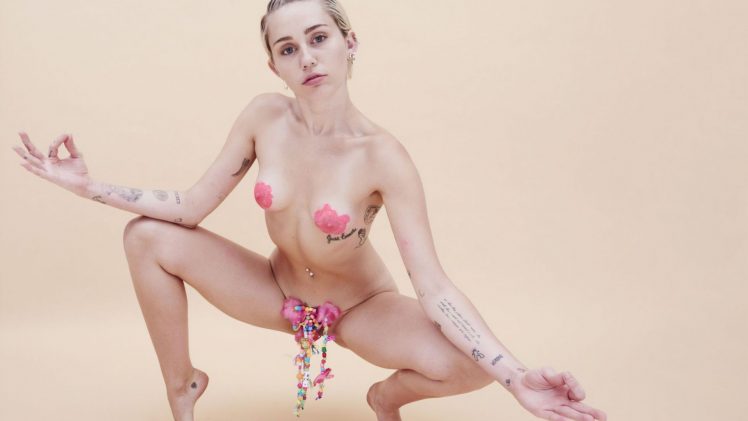Naked Miley Cyrus showing off her small breasts and hairy pussy (a lot)