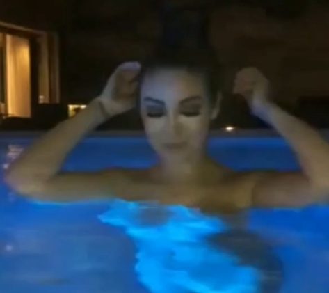 Naked Lucero enjoys skinny dipping in a well-lit swimming pool