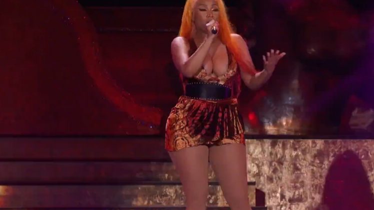 Nicki Minaj busts out of her top during a live performance (nip slip)