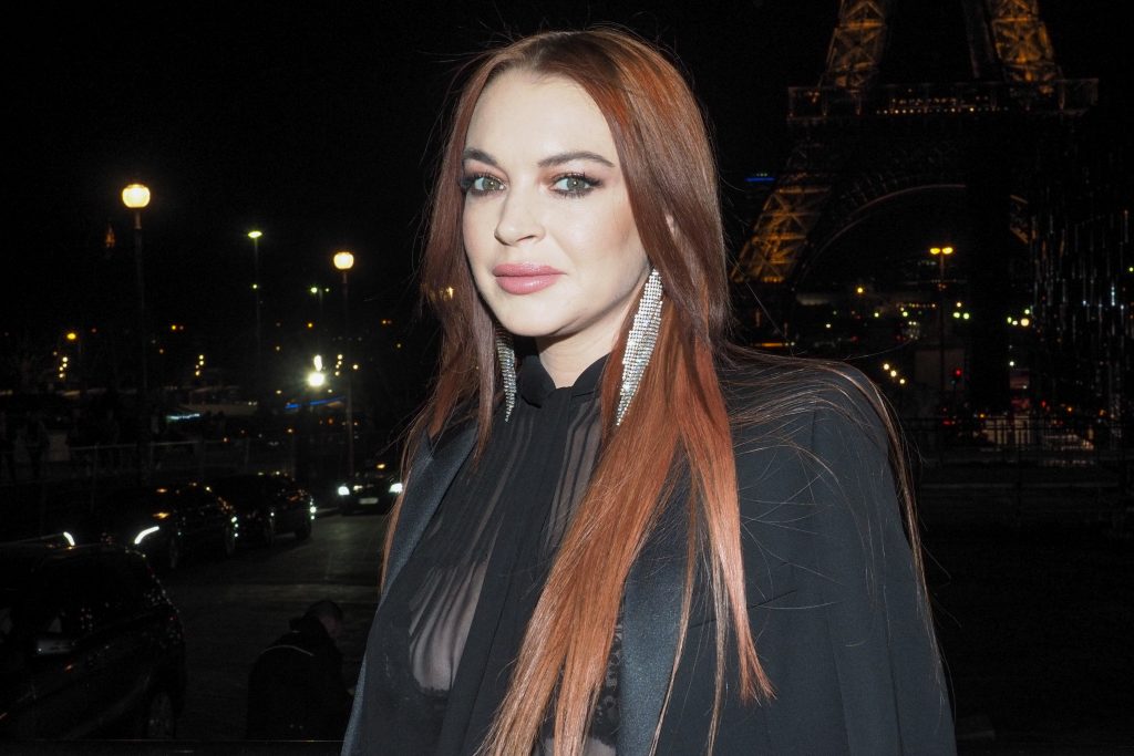 Lindsay Lohan Walking Around in a See-Through Black Blouse gallery, pic 8