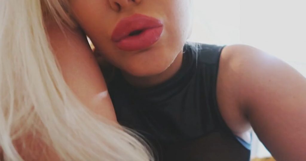 Curvy YouTuber Tara Babcock shows her body in a revealing outfit video screenshot 8