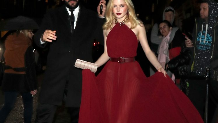 Blonde Beauty Ellie Bamber Stuns in a Semi-Sheer Red Dress
