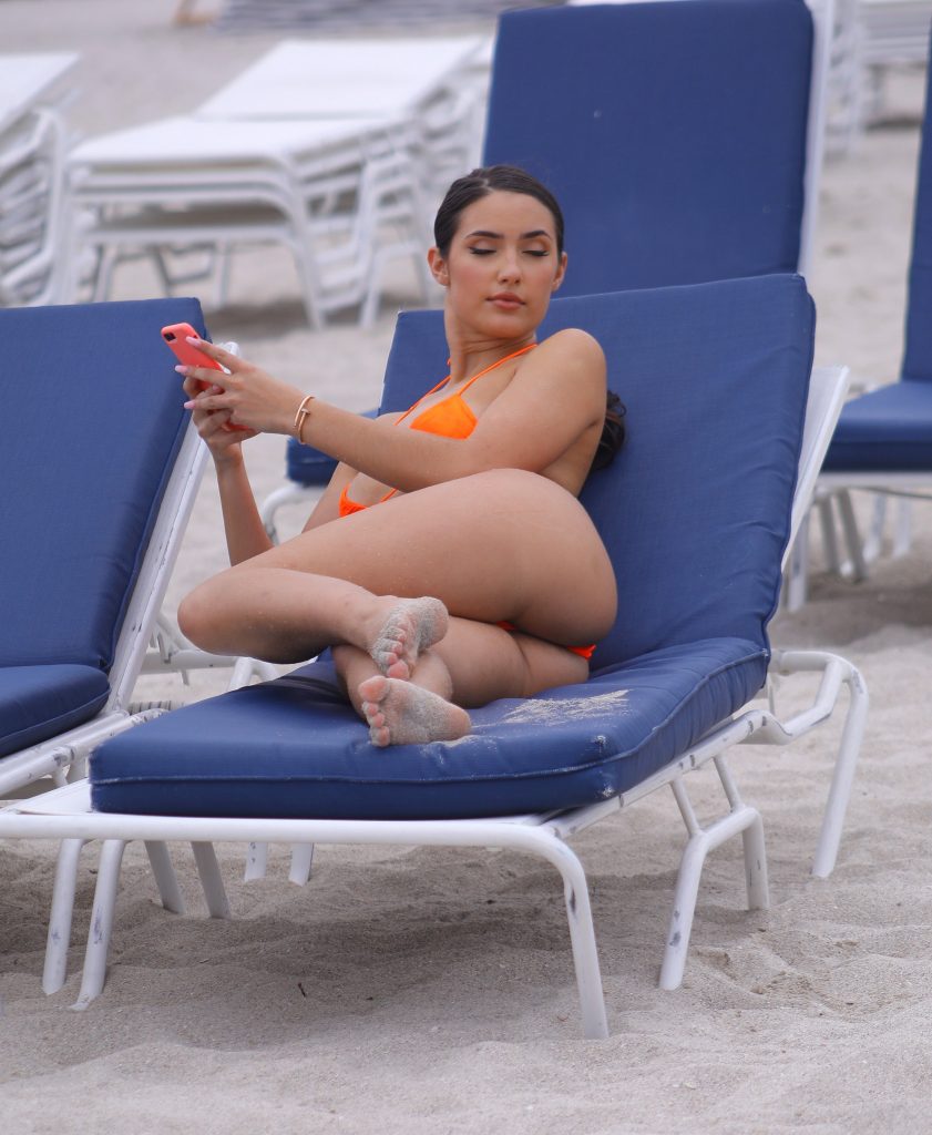 Slim Beauty Tao Wickrath Showing Off in a Tiny Orange Bikini gallery, pic 14
