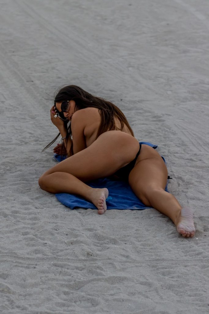 Topless Claudia Romani Rolling Around in the Sand, Looking Dumb gallery, pic 8