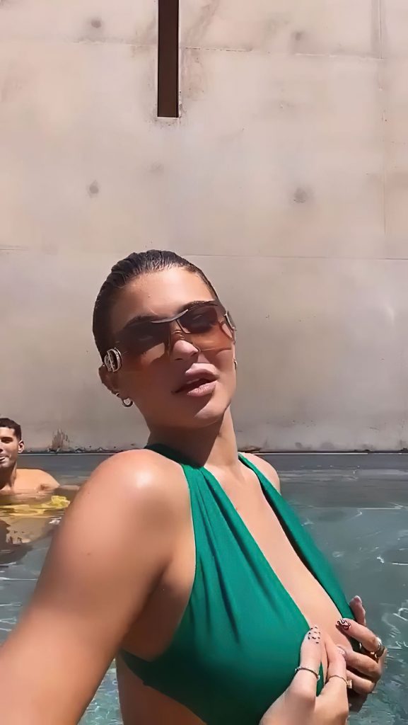 Social Media Superstar Kylie Jenner Flaunts Her Titties in the Pool video screenshot 14