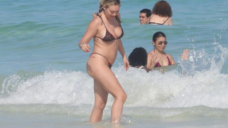 Cheery Corinne Olympios Looks Oddly Chubby in Her Skimpy Swimsuit