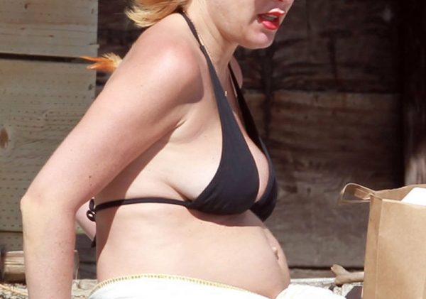 Preggo Tori Spelling Shows Her Small Tits and Long Legs for the Camera