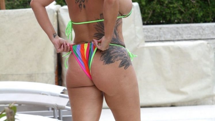 British Reality TV Star Kerry Katona Shows Her Tanned Body on the Beach